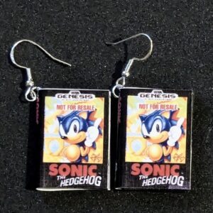 The Sonic the hedgehog cover miniature earrings with fishhook earring backs displayed on a black background.